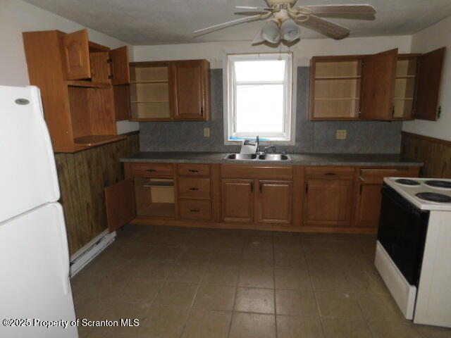 805 Ferdinand Street Scranton, PA 18508 - Photo 5 of 15 a kitchen with stainless steel appliances granite countertop a refrigerator a sink dishwasher a stove and a microwave oven