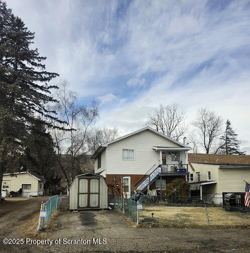 805 Ferdinand Street Scranton, PA 18508 - Photo 6 of 15 a view of house with a big yard and large trees