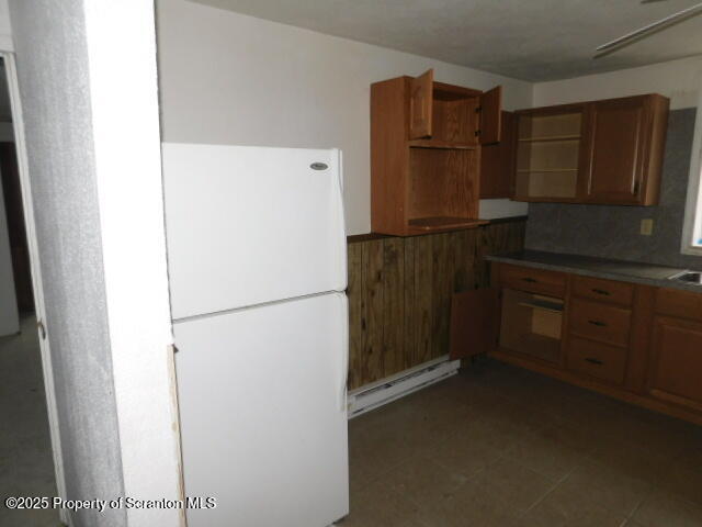 805 Ferdinand Street Scranton, PA 18508 - Photo 7 of 15 a kitchen with a refrigerator and cabinets