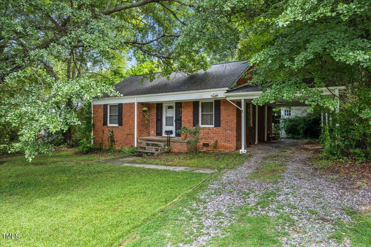 816 North King Charles Road Raleigh, NC 27610 - Photo 1 of 25 a view of a house with backyard porch and garden