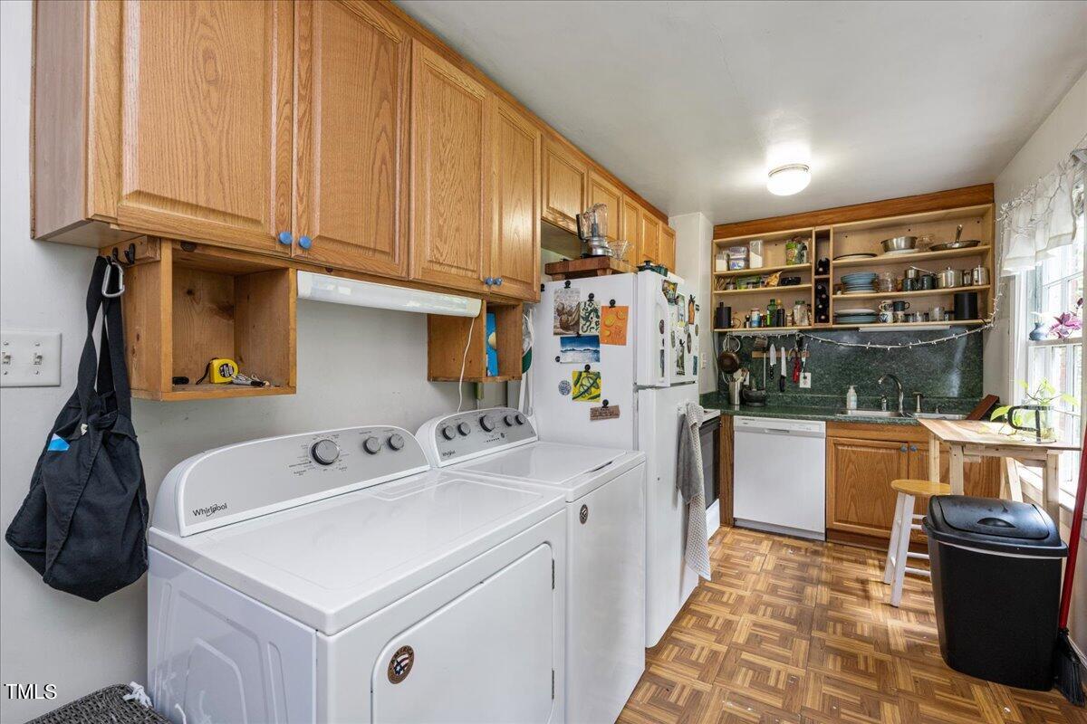 816 North King Charles Road Raleigh, NC 27610 - Photo 12 of 25 a kitchen with a sink and cabinets