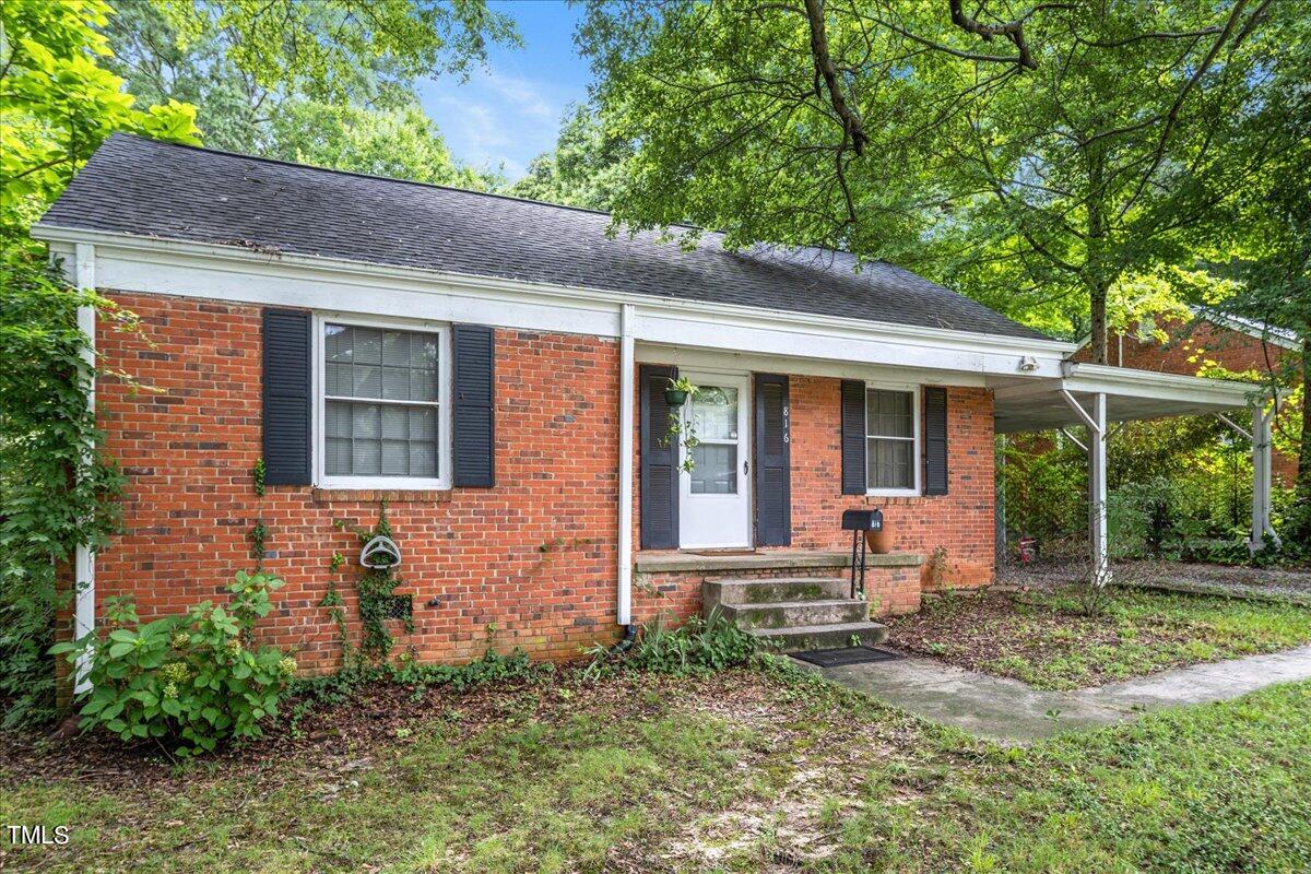 816 North King Charles Road Raleigh, NC 27610 - Photo 25 of 25 a front view of a house with garden