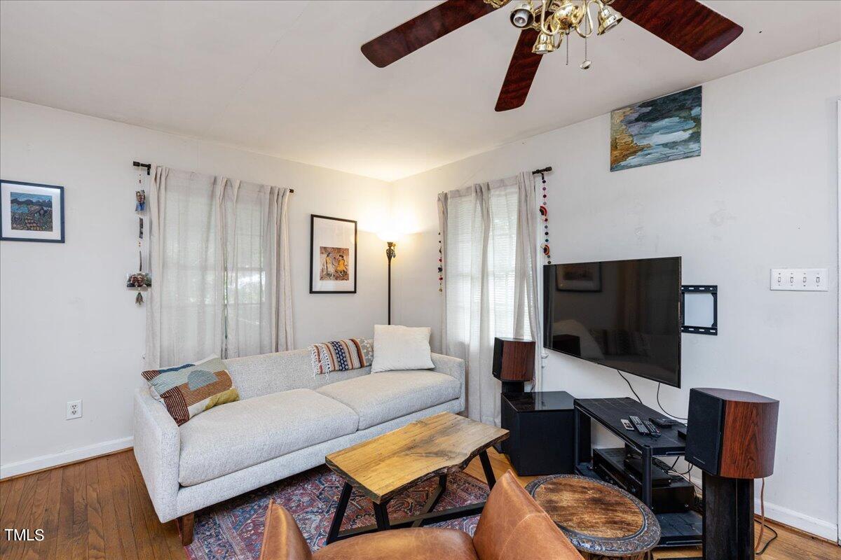 816 North King Charles Road Raleigh, NC 27610 - Photo 5 of 25 a living room with furniture and a flat screen tv