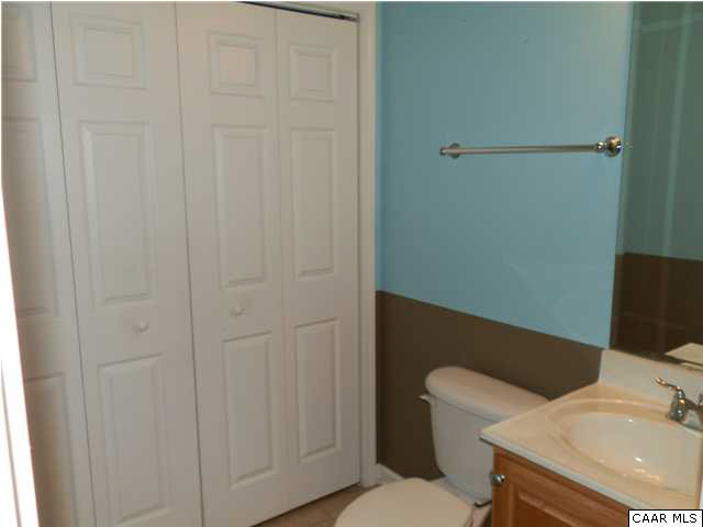 1744 Hanback Road Gordonsville, VA 22942 - Photo 17 of 21 a white toilet sitting next to a bathroom sink