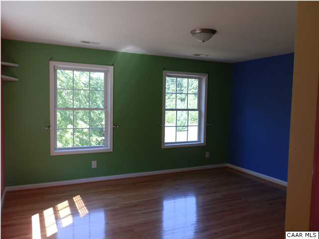 1744 Hanback Road Gordonsville, VA 22942 - Photo 9 of 21 a view of an empty room with wooden floor and a window