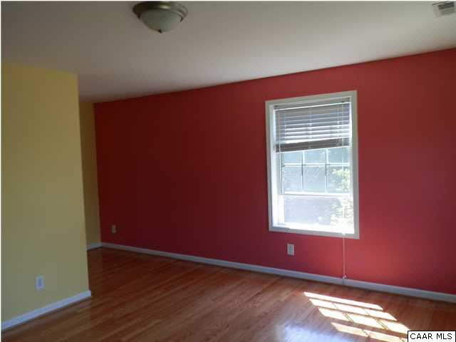 1744 Hanback Road Gordonsville, VA 22942 - Photo 10 of 21 a view of an empty room with wooden floor and a window