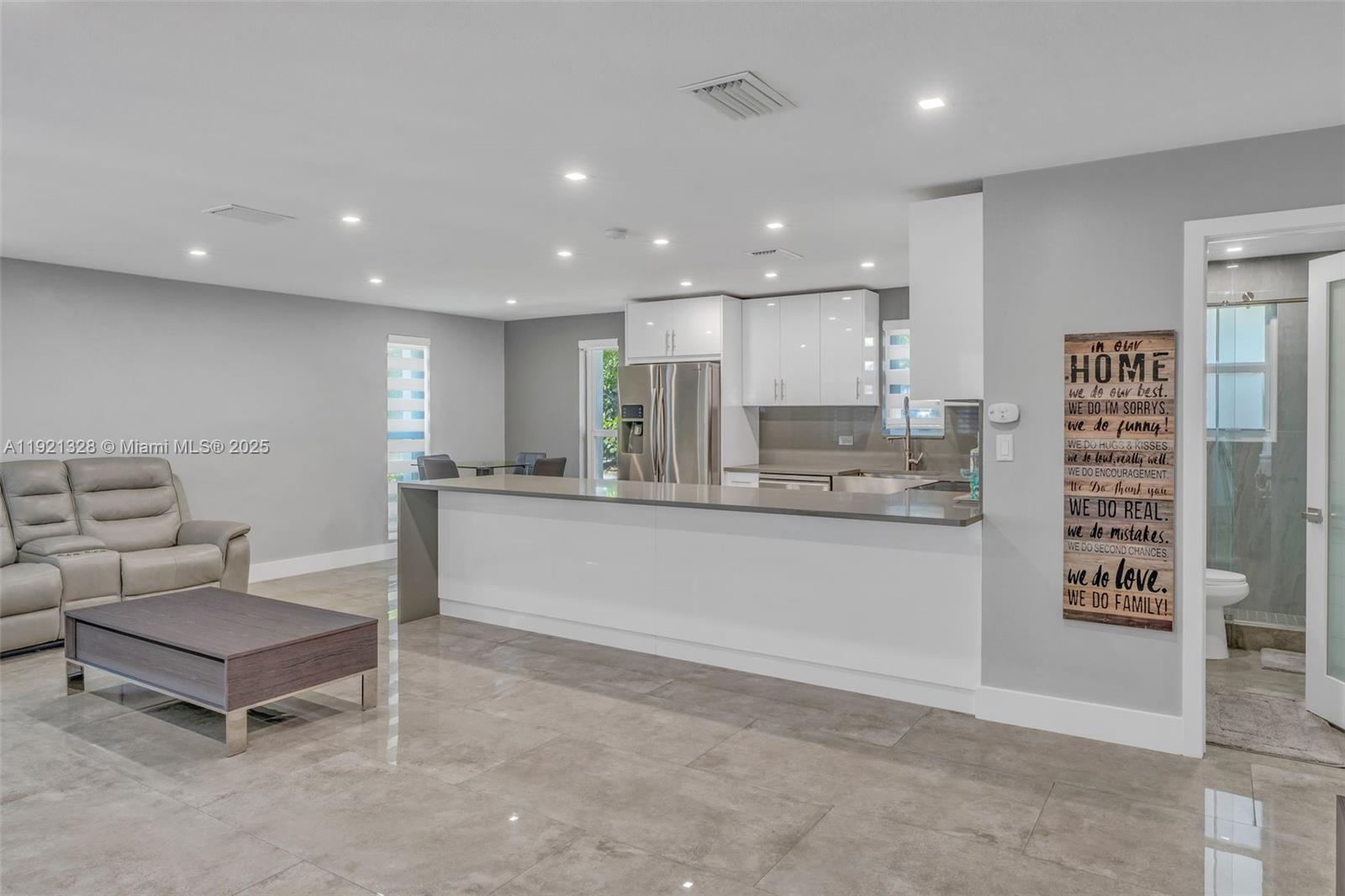 222 2nd Road Key Largo, FL 33037 - Photo 12 of 43 a living room with stainless steel appliances kitchen island granite countertop furniture and a view of kitchen