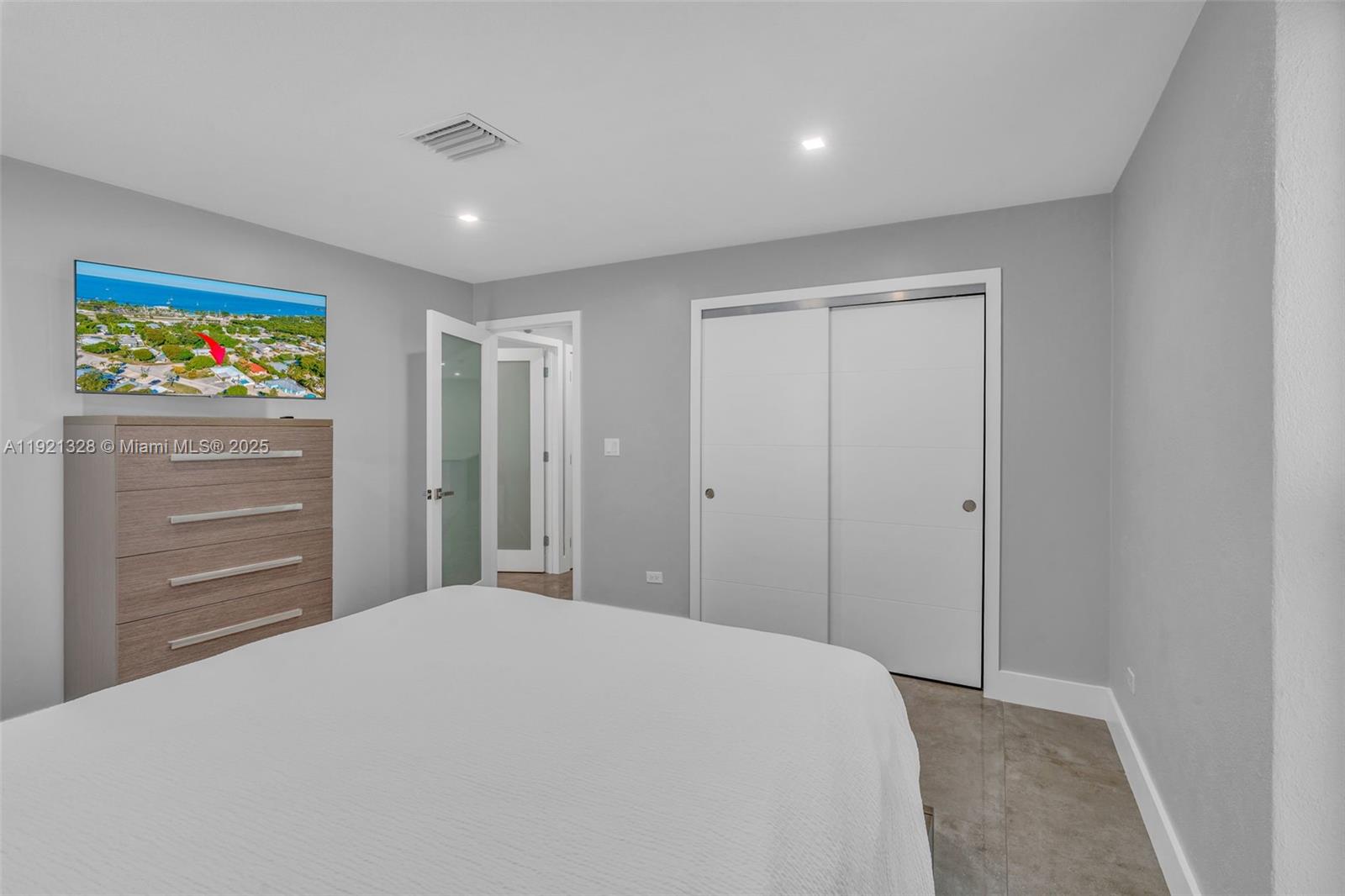 222 2nd Road Key Largo, FL 33037 - Photo 16 of 43 a bedroom with a large bed and a cabinets