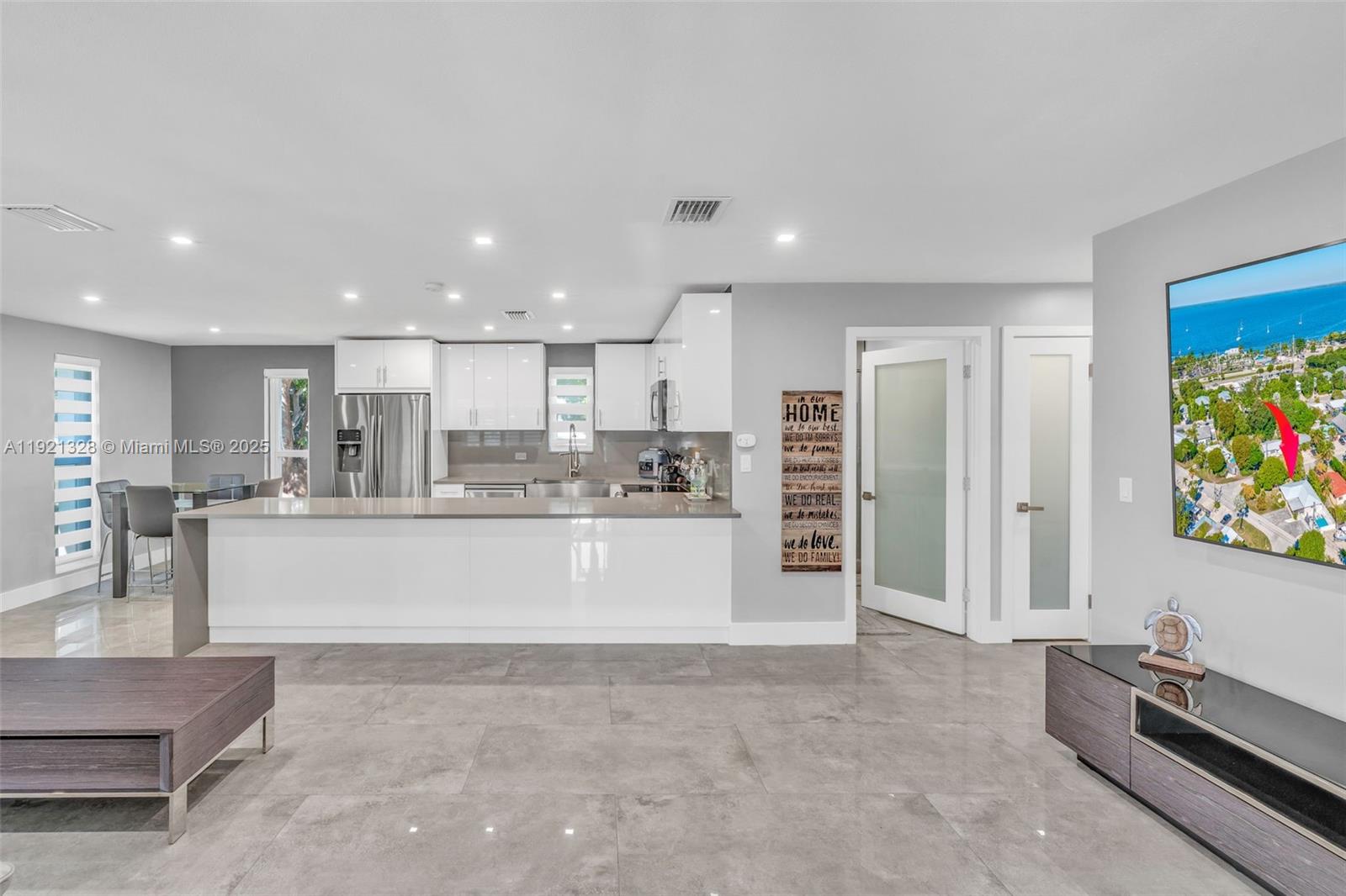 222 2nd Road Key Largo, FL 33037 - Photo 3 of 43 a view of kitchen with kitchen island white cabinets and refrigerator