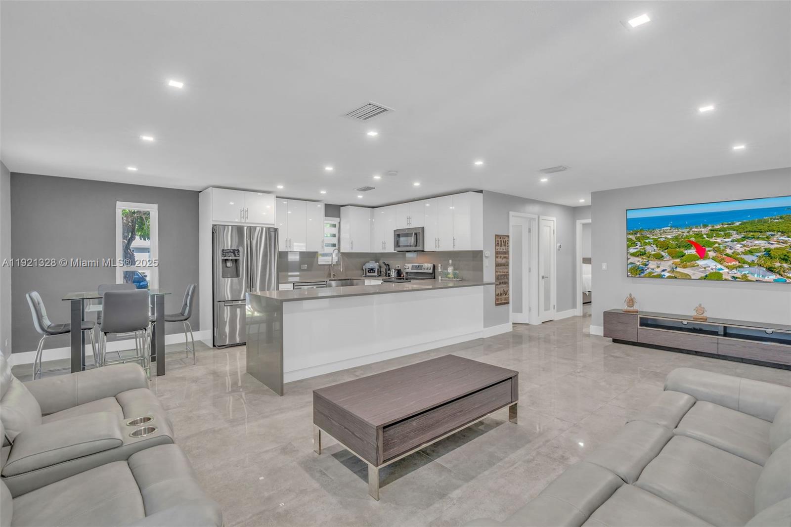 222 2nd Road Key Largo, FL 33037 - Photo 6 of 43 a living room with stainless steel appliances kitchen island granite countertop furniture and a view of kitchen