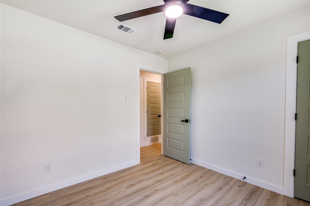 509 Steeple Ridge Court Everman, TX 76140 - Photo 11 of 21 Spare room with light wood-style floors and a ceiling fan