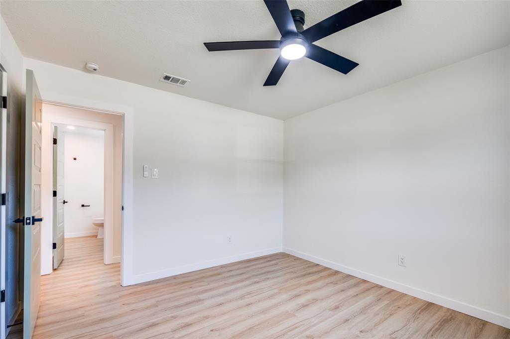 509 Steeple Ridge Court Everman, TX 76140 - Photo 6 of 21 Spare room with wood finished floors and a ceiling fan