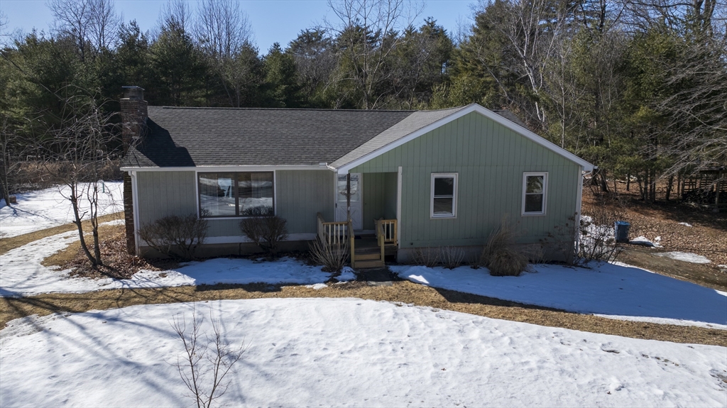 76 Beaver Lake Road Ware, MA 01082 - Photo 1 of 23 a view of a house with backyard and trees