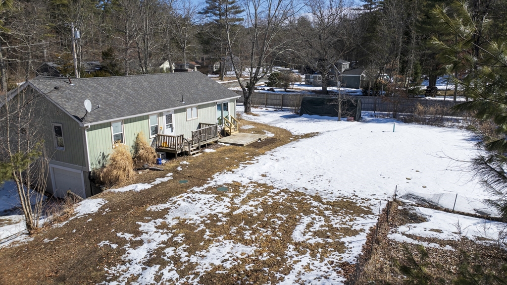 76 Beaver Lake Road Ware, MA 01082 - Photo 4 of 23 a view of a house with a yard covered in snow