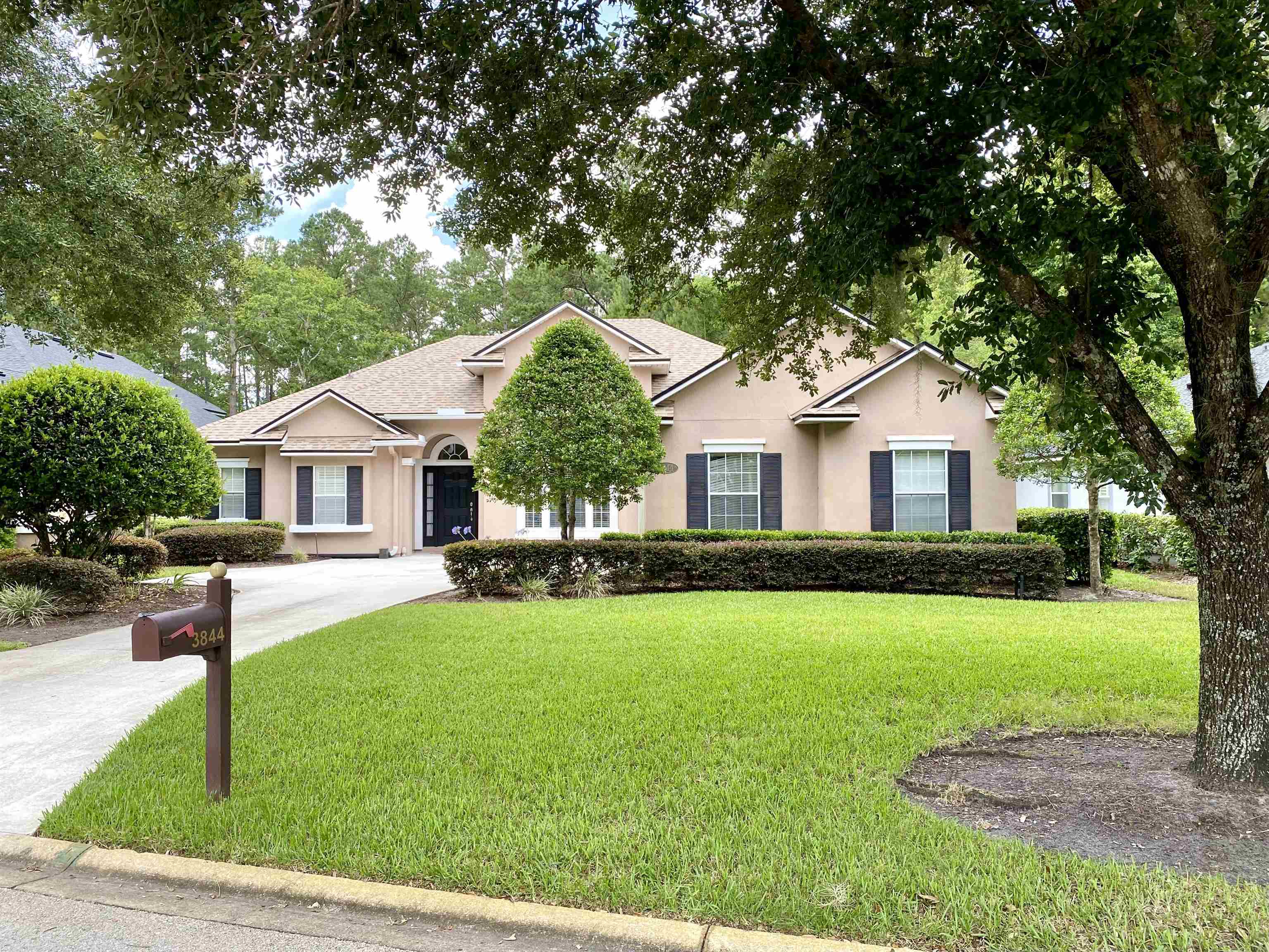 3844 Paddington Place St. Augustine, FL 32092 - Photo 40 of 40 a front view of a house with a yard and garage