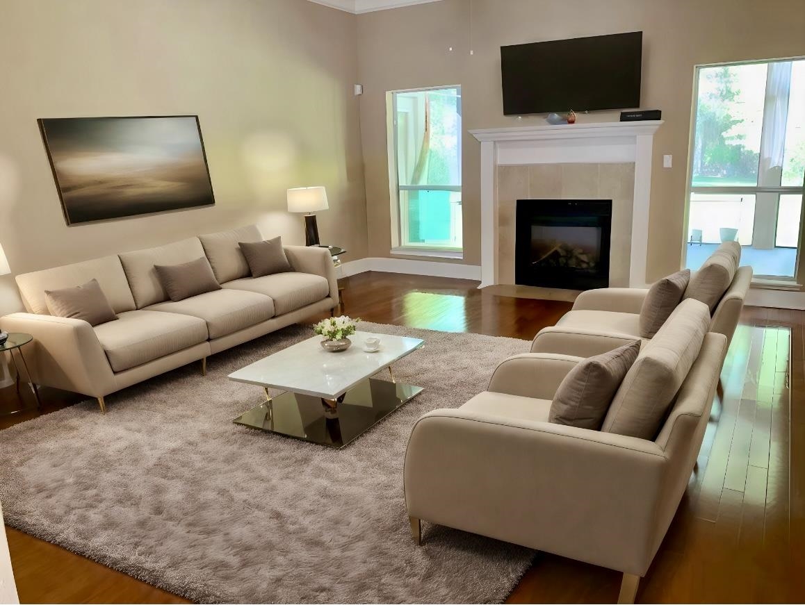 3844 Paddington Place St. Augustine, FL 32092 - Photo 4 of 40 a living room with furniture a flat screen tv and a fireplace