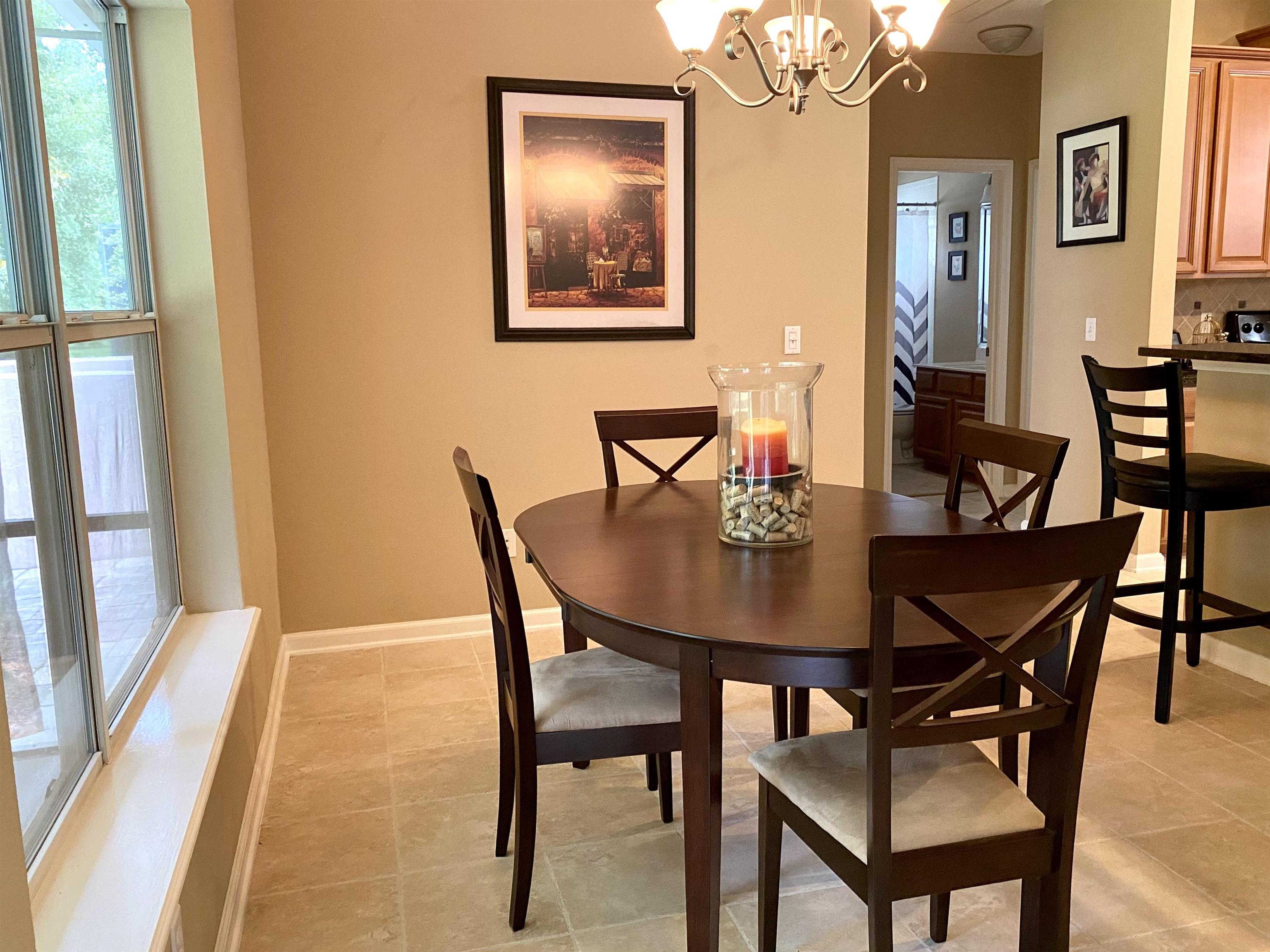 3844 Paddington Place St. Augustine, FL 32092 - Photo 8 of 40 a view of a dining room with furniture and a large window