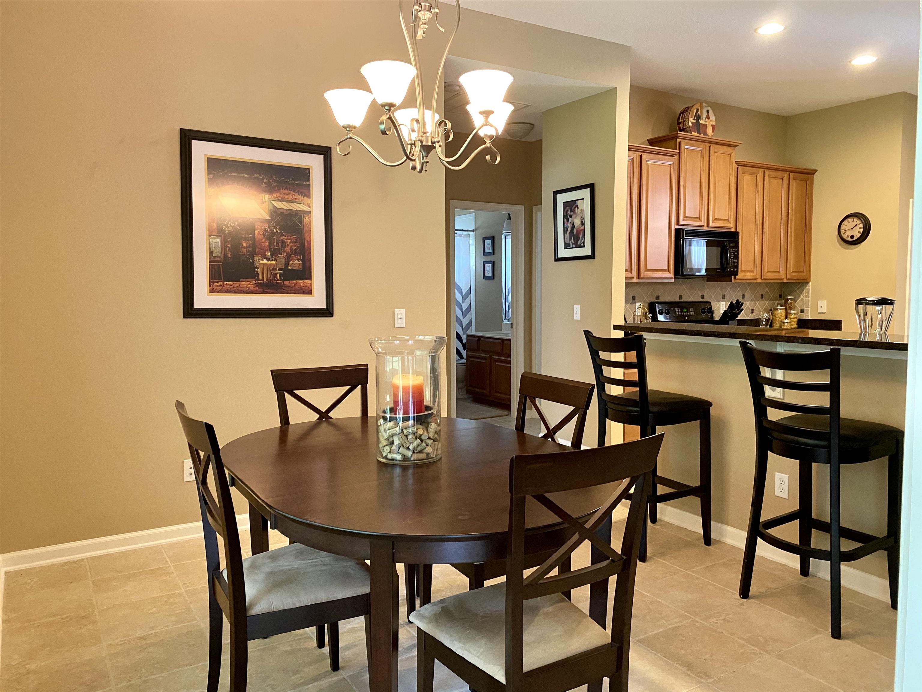 3844 Paddington Place St. Augustine, FL 32092 - Photo 9 of 40 a view of a dining room with furniture and wooden floor