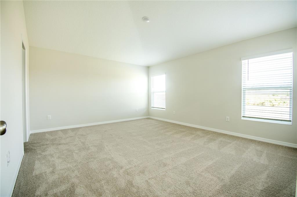 37056 Sagemoor Drive Zephyrhills, FL 33540 - Photo 16 of 21 an empty room with a window