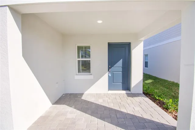 a view of entryway with wooden floor and garden