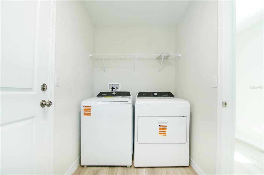 37056 Sagemoor Drive Zephyrhills, FL 33540 - Photo 3 of 21 a utility room with dryer and washer
