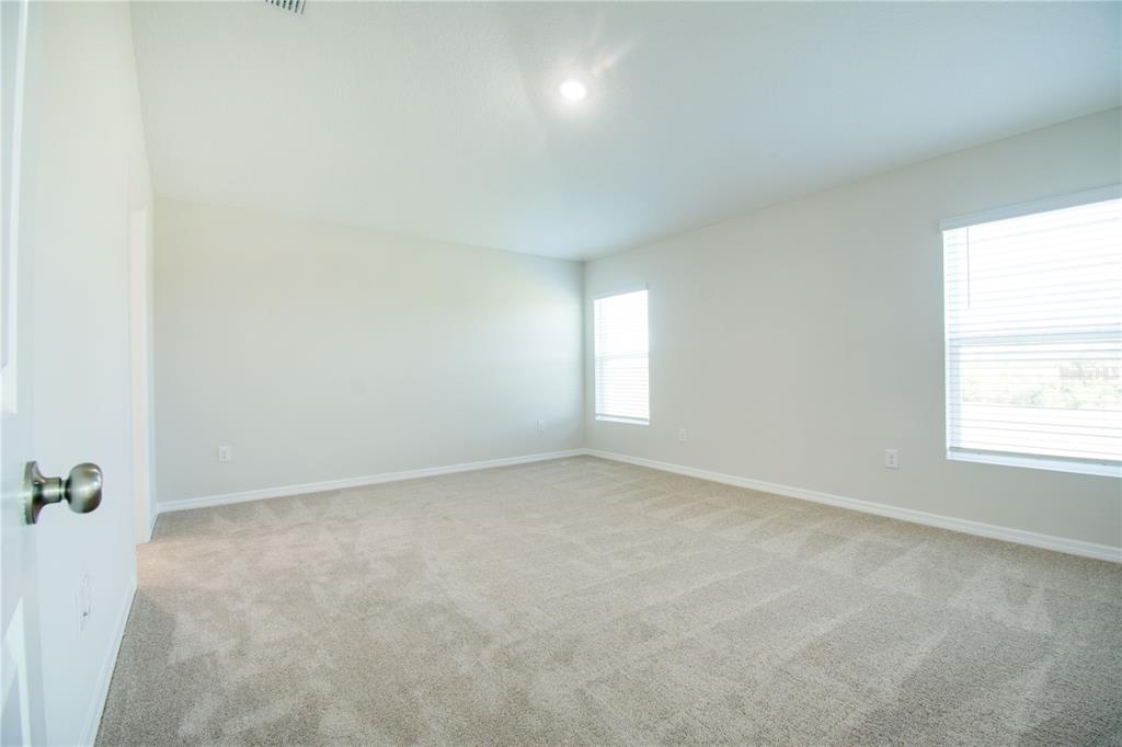 37056 Sagemoor Drive Zephyrhills, FL 33540 - Photo 10 of 21 an empty room with a window