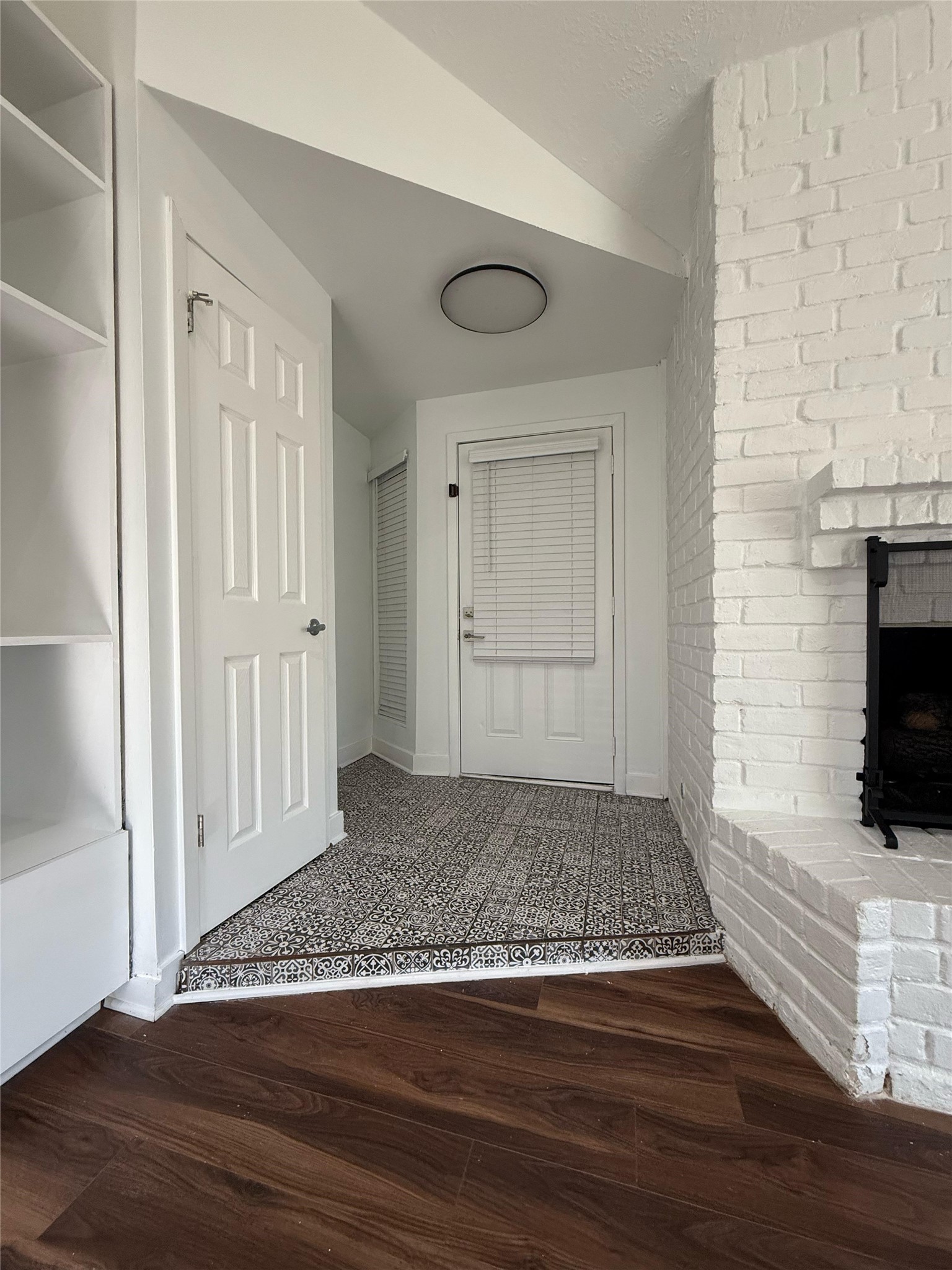 11906 Rowood Drive Houston, TX 77070 - Photo 3 of 20 a view of an empty room with wooden floor and a fireplace