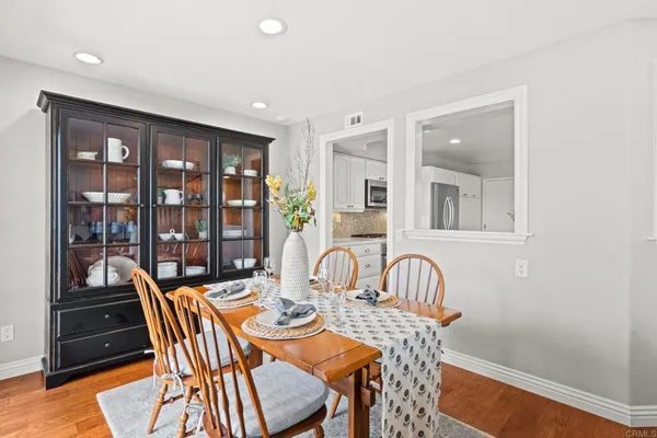 a dining room with furniture and window