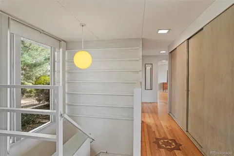 a kitchen with stainless steel appliances granite countertop a refrigerator a stove and a sink