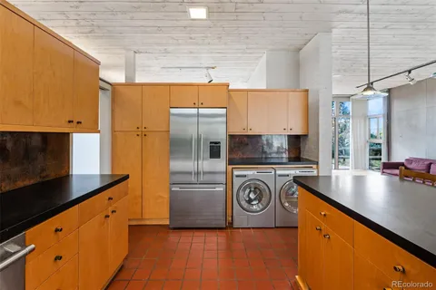 a view of a chair and table of the house
