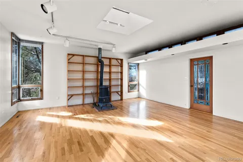 a living room with a large window and a table