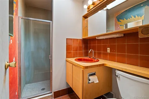 a view of an empty room with a fireplace