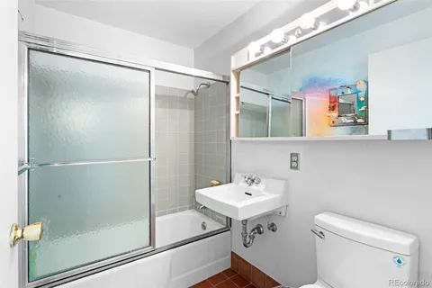 a view of a yard covered with snow in front of house