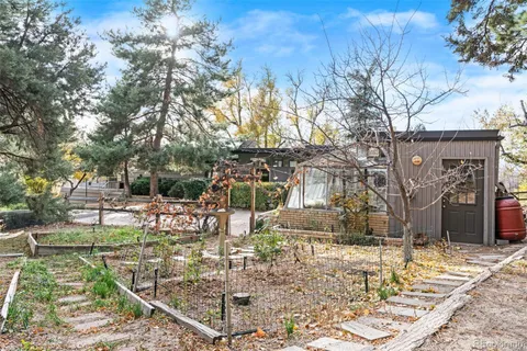 view of a house with a yard and sitting area
