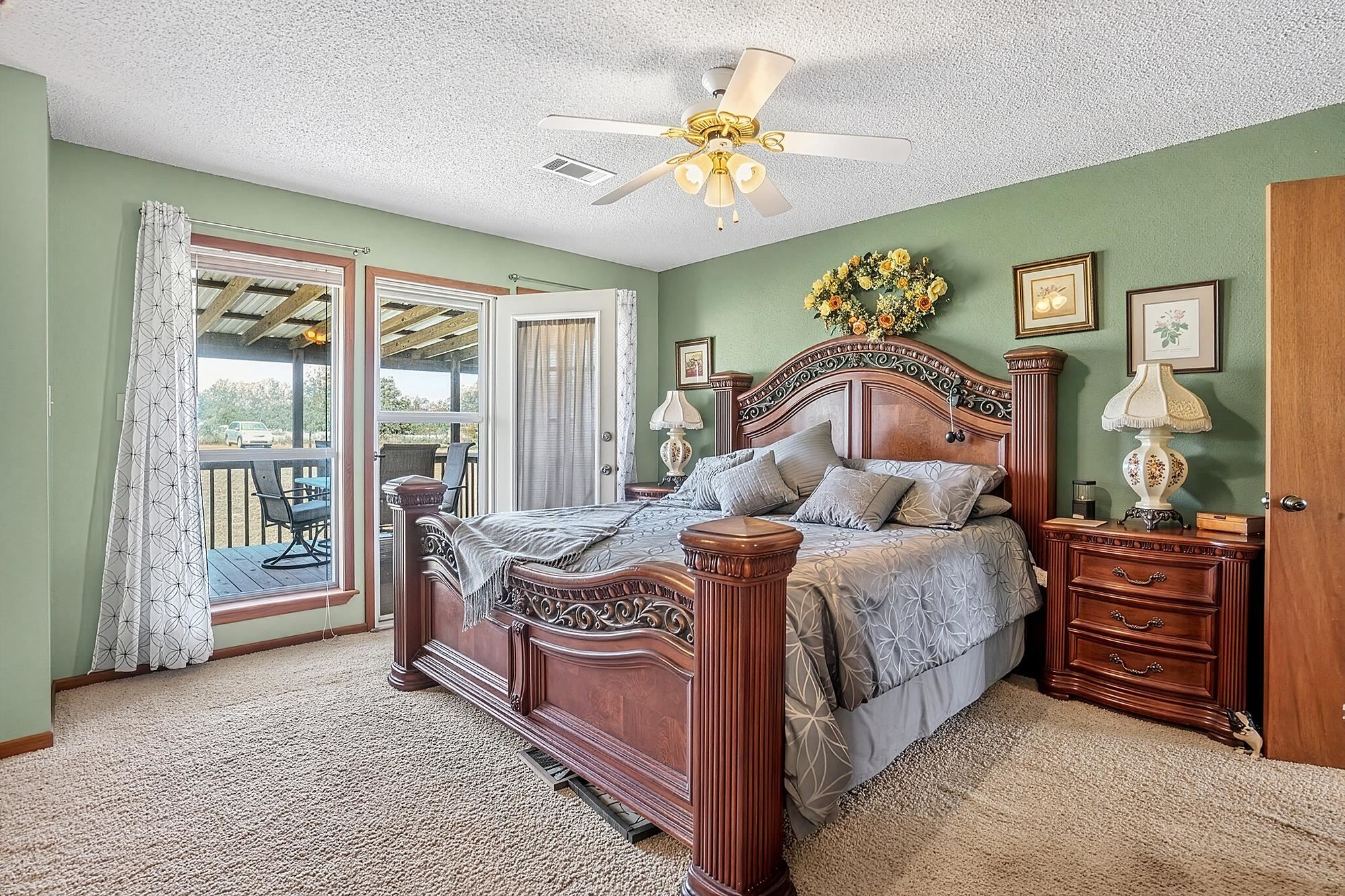 10465 Ranch To Market 1431 Buchanan Dam, TX 78609 - Photo 24 of 29 a bedroom with a bed table and window