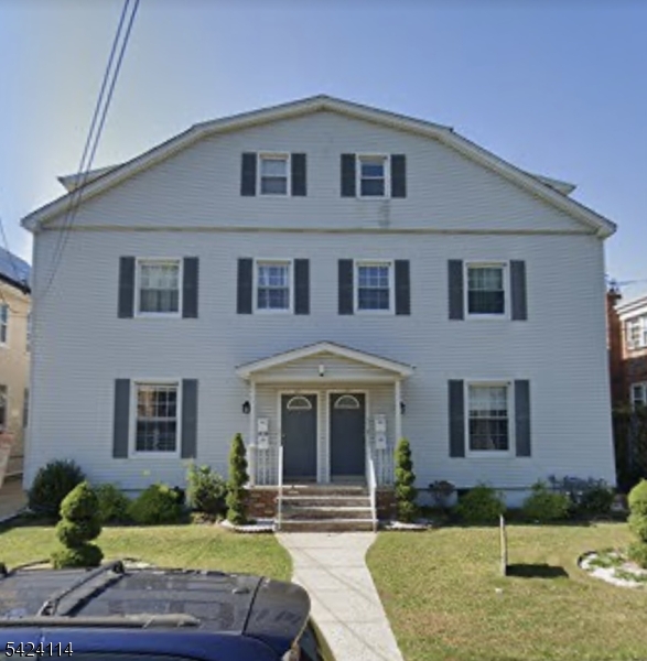 24 Lyons Place Elizabeth, NJ 07202 - Photo 1 of 1 a front view of a house with garden