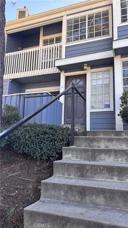 a view of a house with a yard and deck