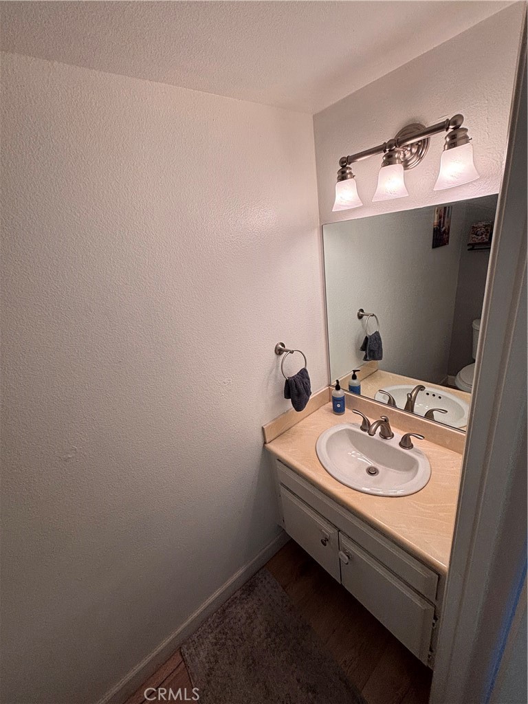 103 West Spring Street, Unit A Long Beach, CA 90806 - Photo 12 of 27 a bathroom with a sink and a mirror