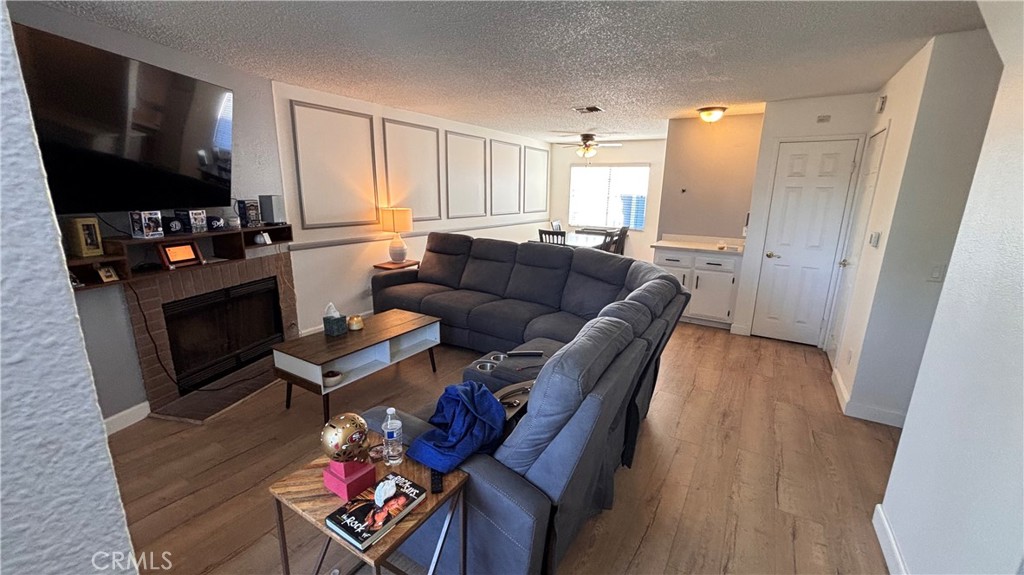 103 West Spring Street, Unit A Long Beach, CA 90806 - Photo 21 of 27 a living room with furniture and a flat screen tv
