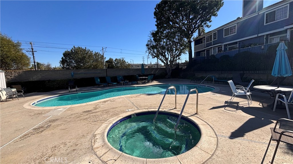 103 West Spring Street, Unit A Long Beach, CA 90806 - Photo 5 of 27 a view of swimming pool with a patio