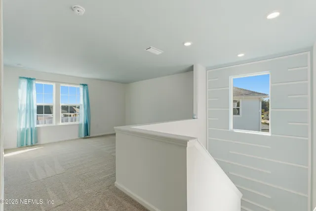 a view of empty room with windows