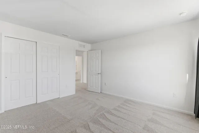 a house view with a big yard