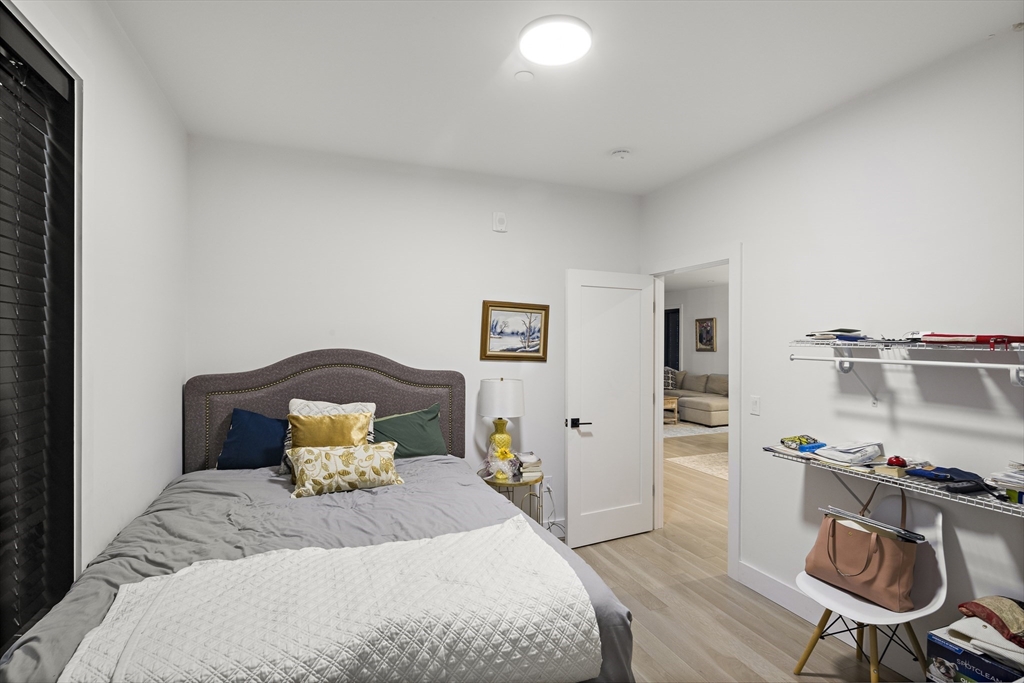 68 Armandine Street, Unit 3 Boston, MA 02124 - Photo 13 of 23 a bedroom with a bed and furniture