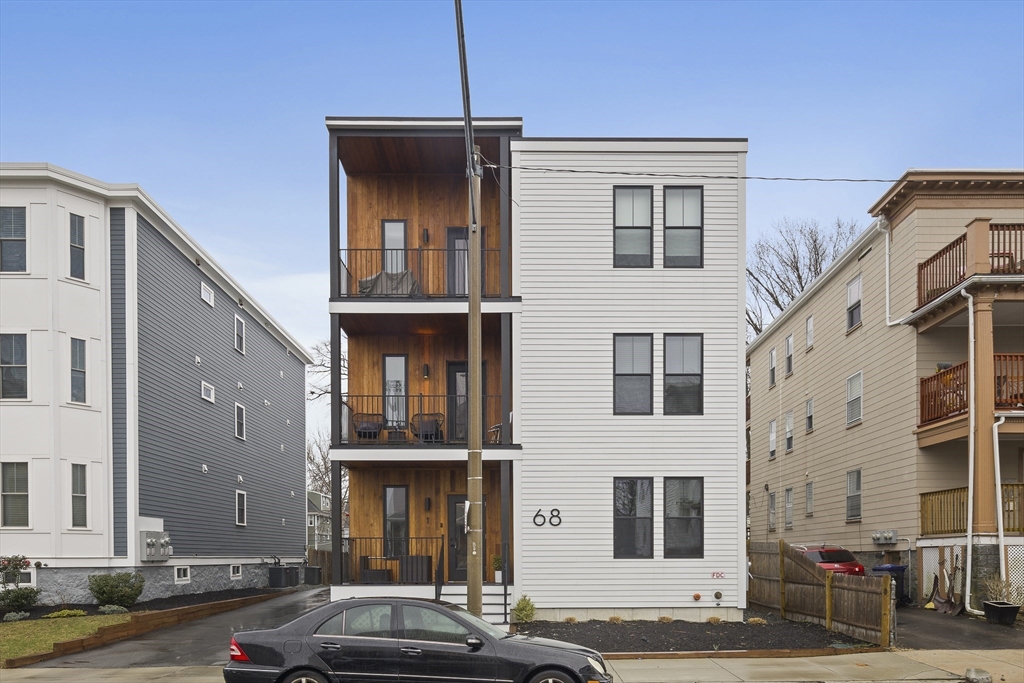 68 Armandine Street, Unit 3 Boston, MA 02124 - Photo 21 of 23 a car parked in front of a building