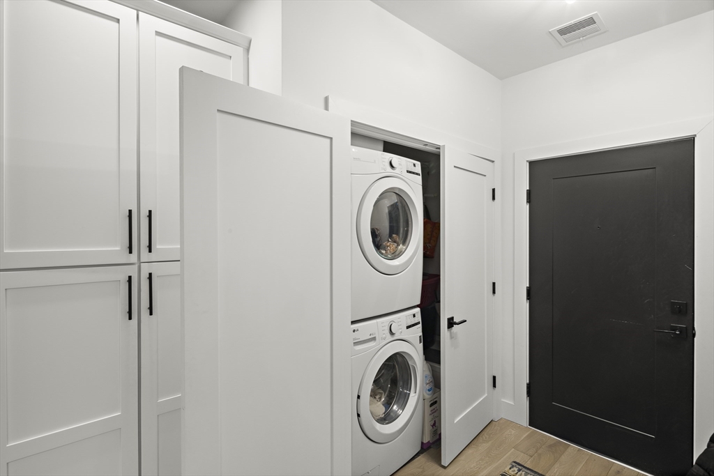 68 Armandine Street, Unit 3 Boston, MA 02124 - Photo 4 of 23 a utility room with dryer and washer