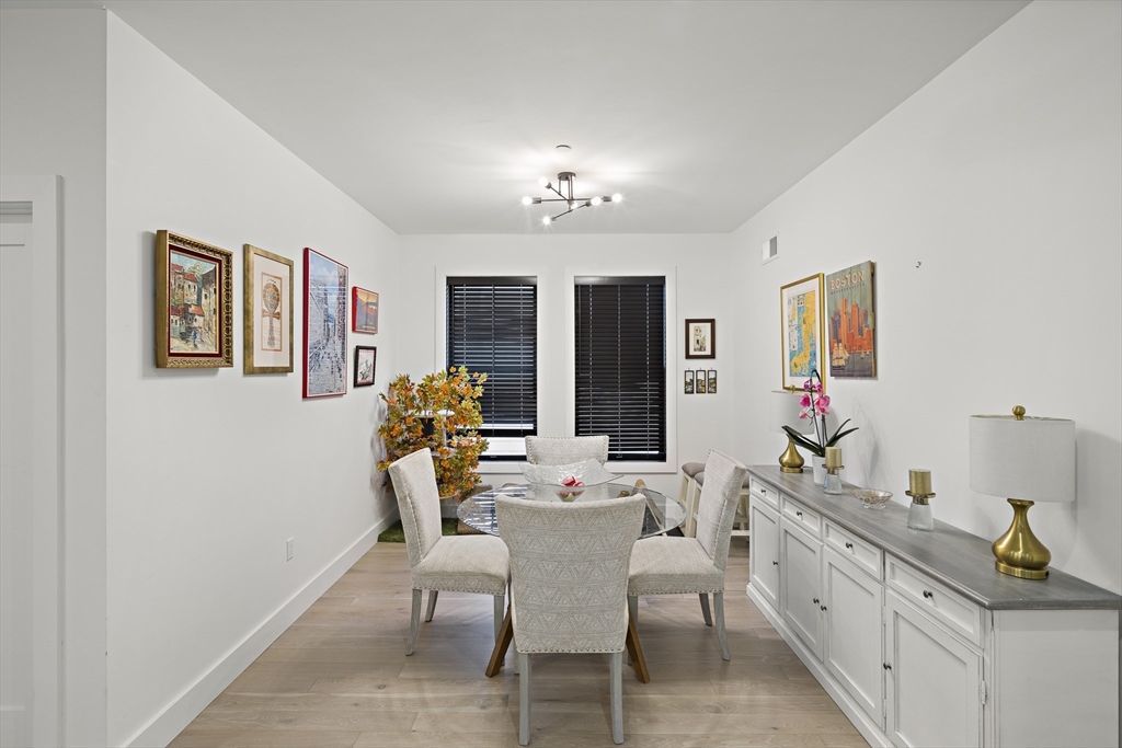 68 Armandine Street, Unit 3 Boston, MA 02124 - Photo 5 of 23 a dining room with furniture and window
