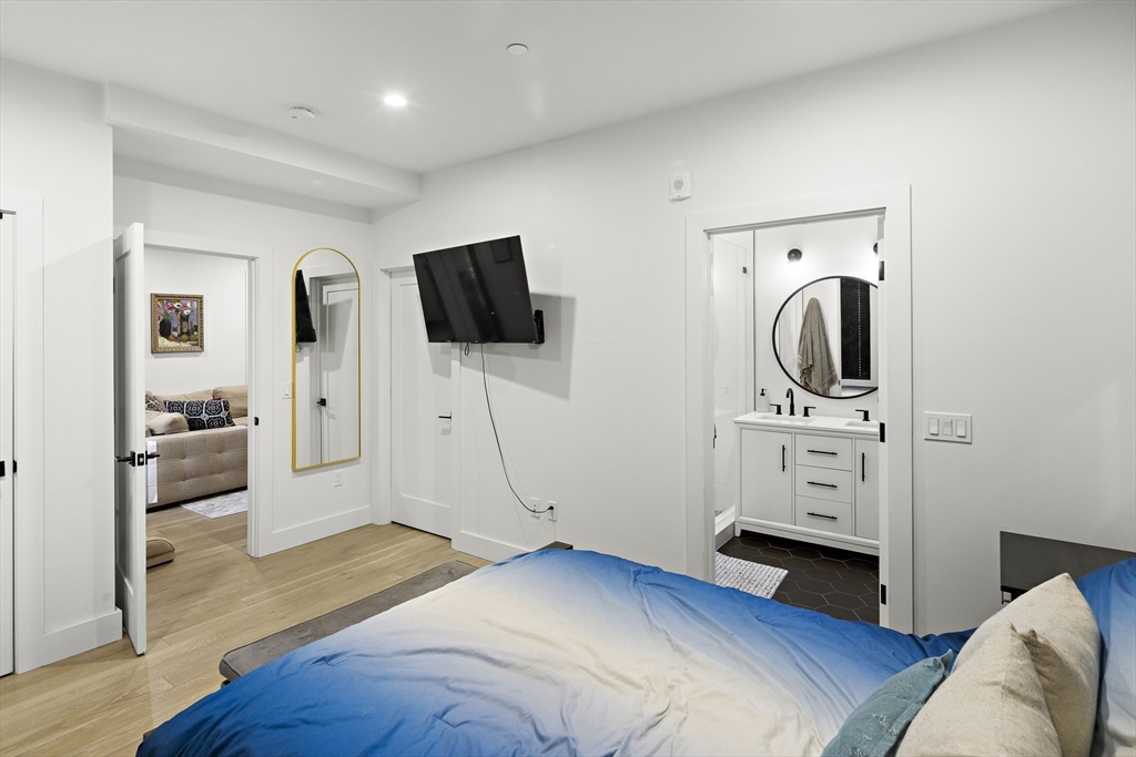 68 Armandine Street, Unit 3 Boston, MA 02124 - Photo 9 of 23 a view of a livingroom with furniture and a flat screen tv