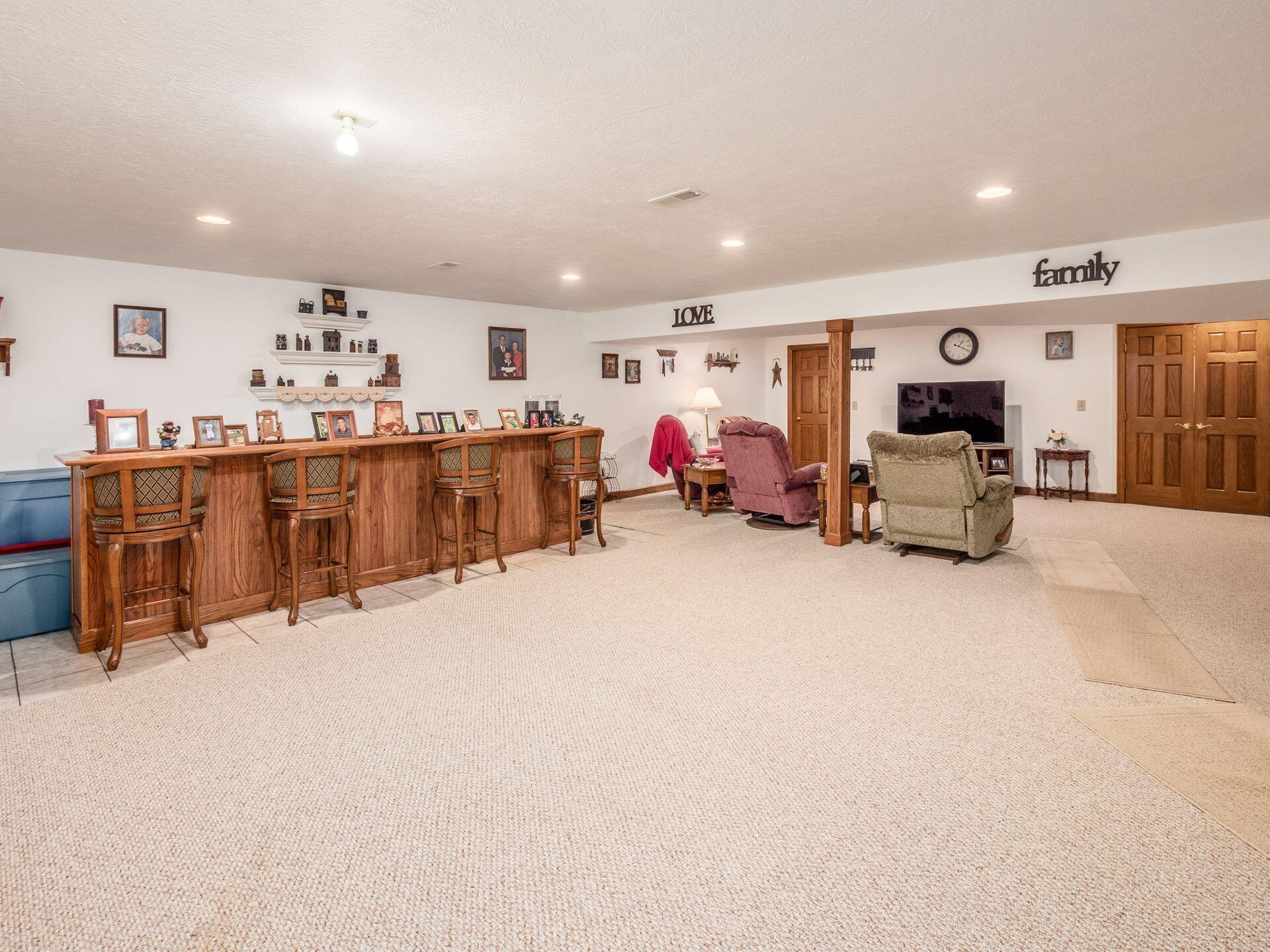 12540 Walker Road Ashville, OH 43103 - Photo 45 of 64 finished lower level w/custom bar
