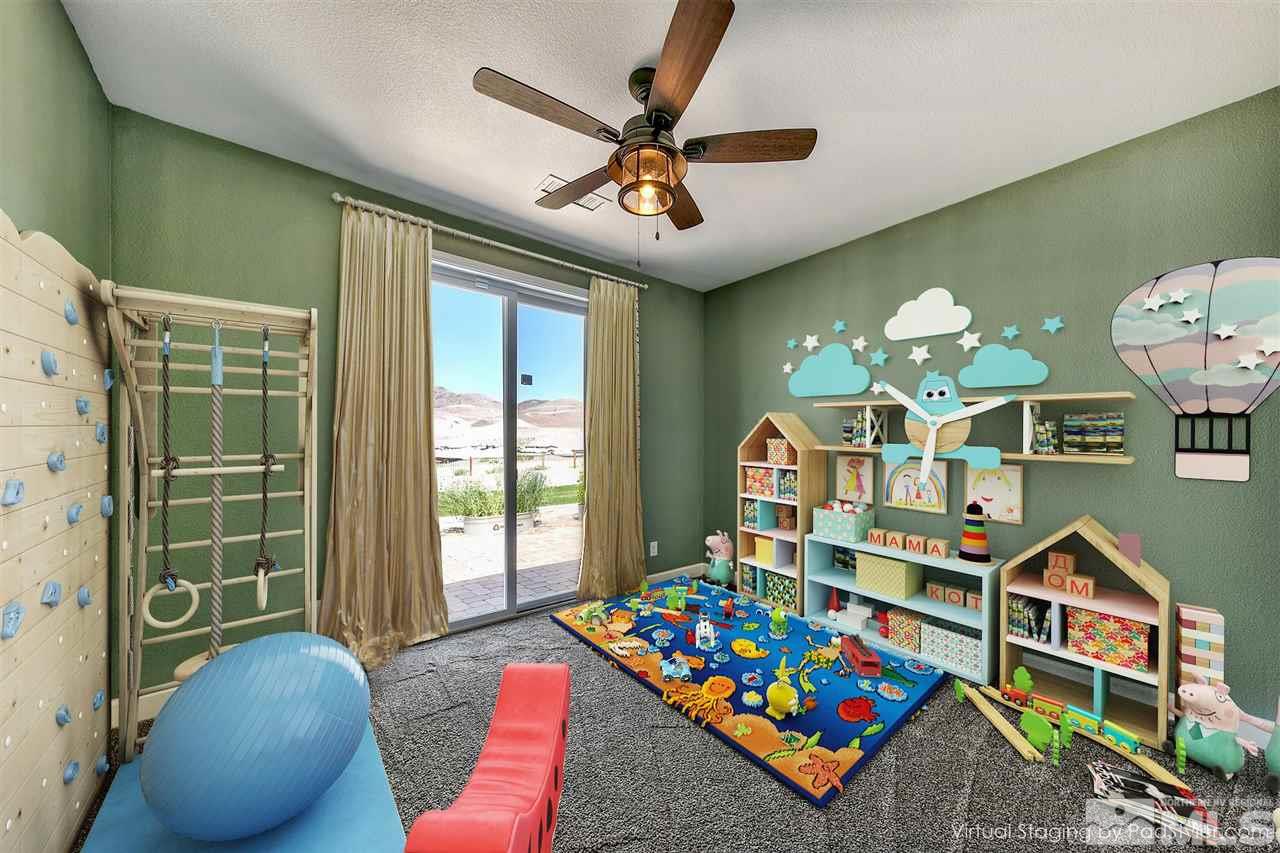 2985 Bull Rider Drive Reno, NV 89521 - Photo 11 of 16 a living room with furniture and a baby crib