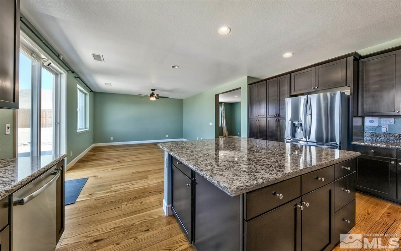 2985 Bull Rider Drive Reno, NV 89521 - Photo 4 of 16 a bathroom with a granite countertop sink and a mirror